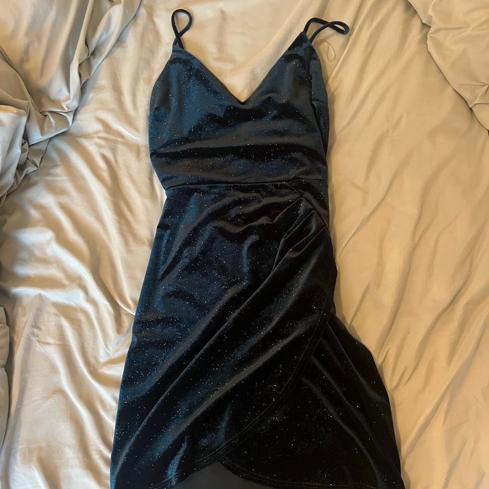 green dress with small rhinestones and small slit at the leg